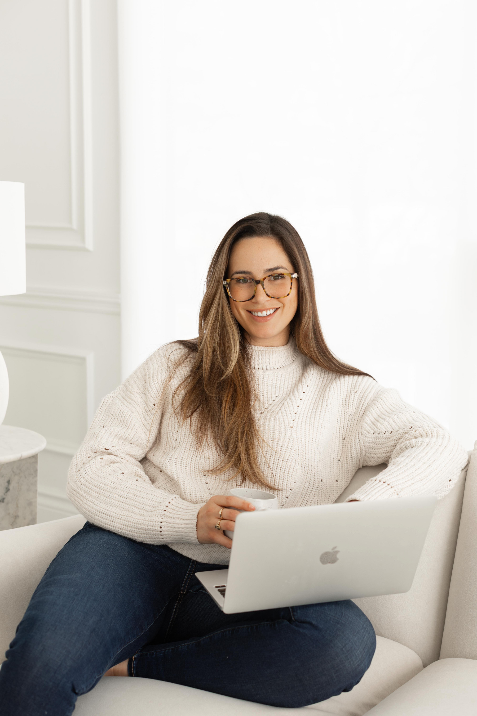 Audrey Locane smiling on a couch, offering virtual support across Ontario and in-person counselling